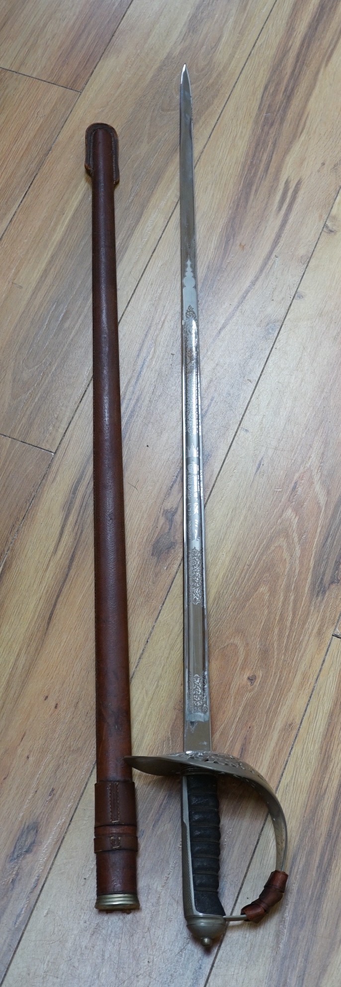 A George VI Royal Corps of Signals officer's sword in leather scabbard, 100cms long